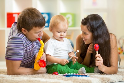 Happy family play musical toys