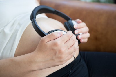 Pregnant woman listen to the music