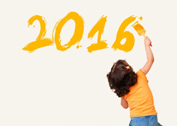 Little girl painting new year 2016